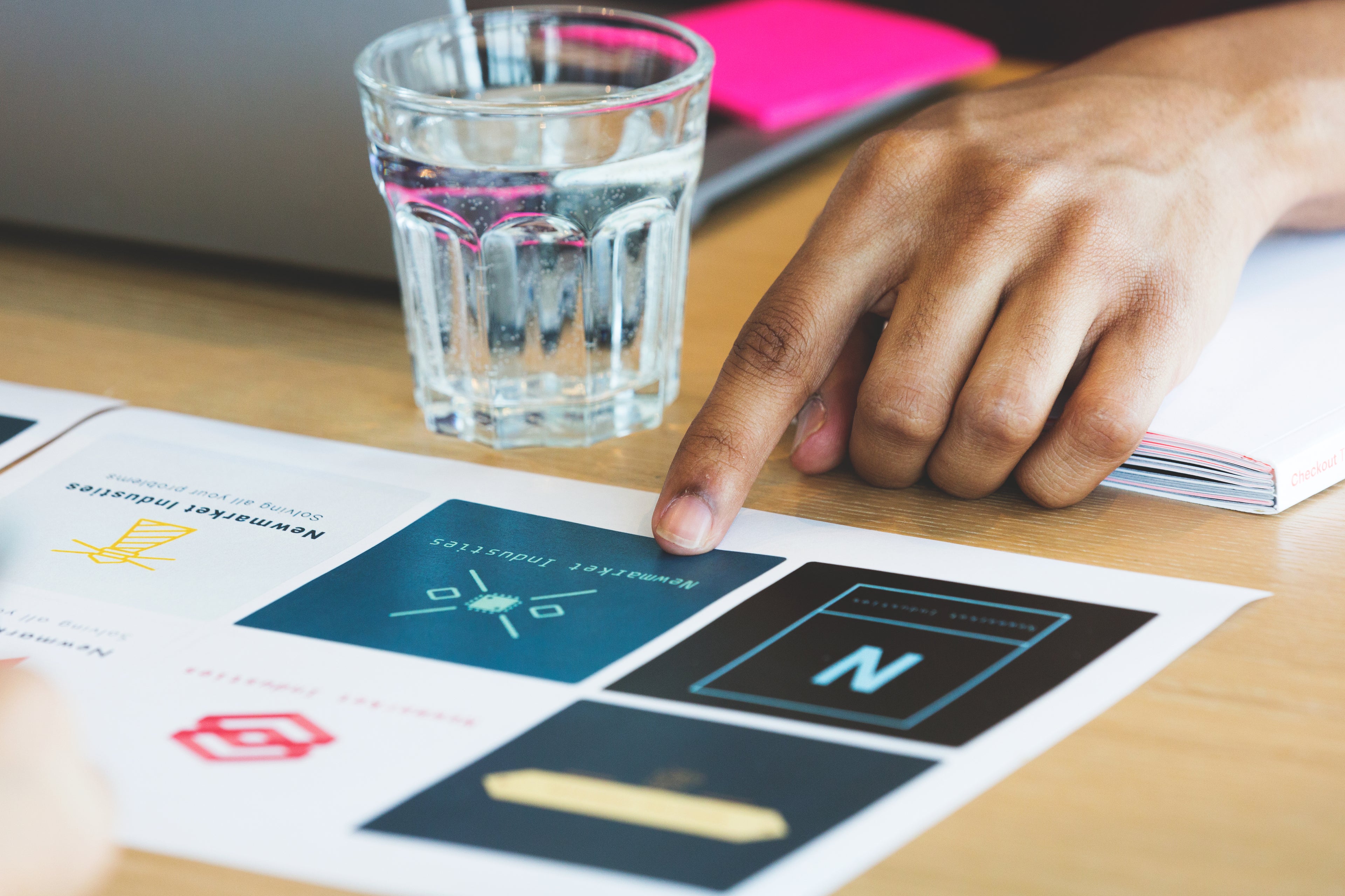 HXDCML hand-with-design-options-at-meeting